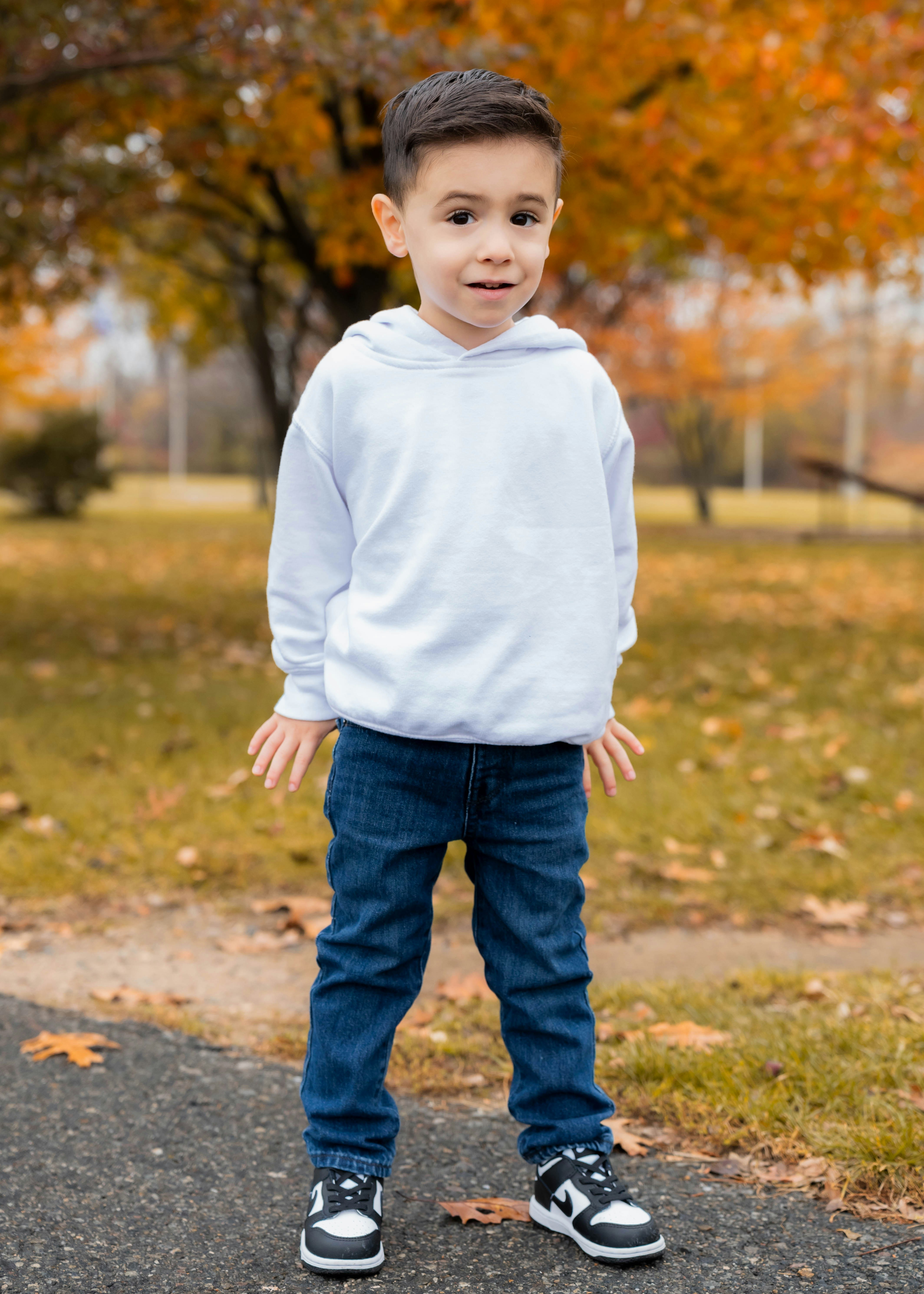 Original photo of a young boy outdoors in autumn